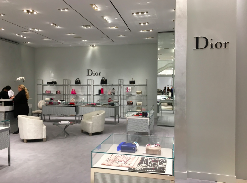 Temporary Dior accessory concession on the ground floor, next to a recently opened Saint Laurent boutique