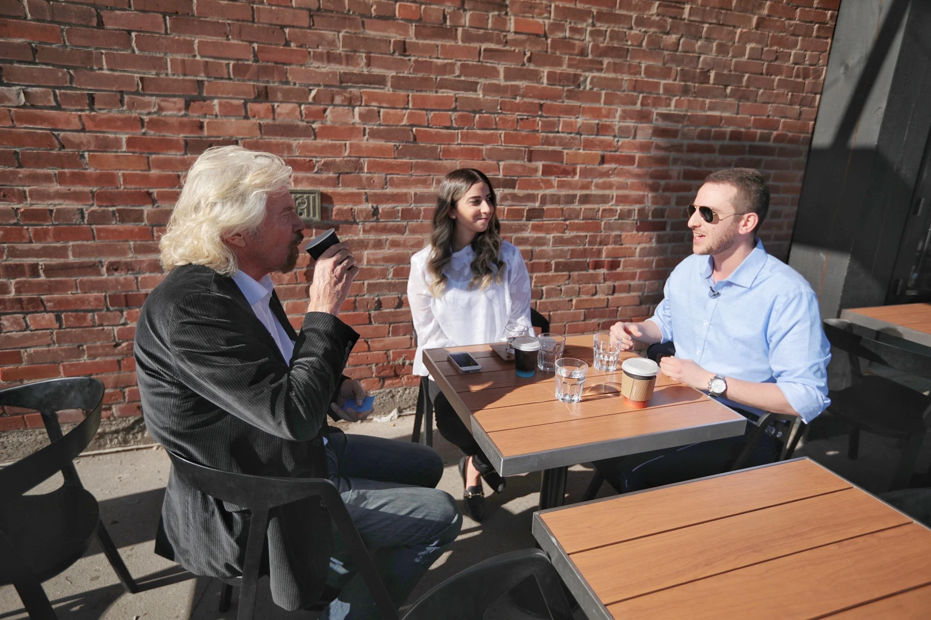 Richard branson sits with Swob's Stephanie and Alexander in Calgary.&nbsp;