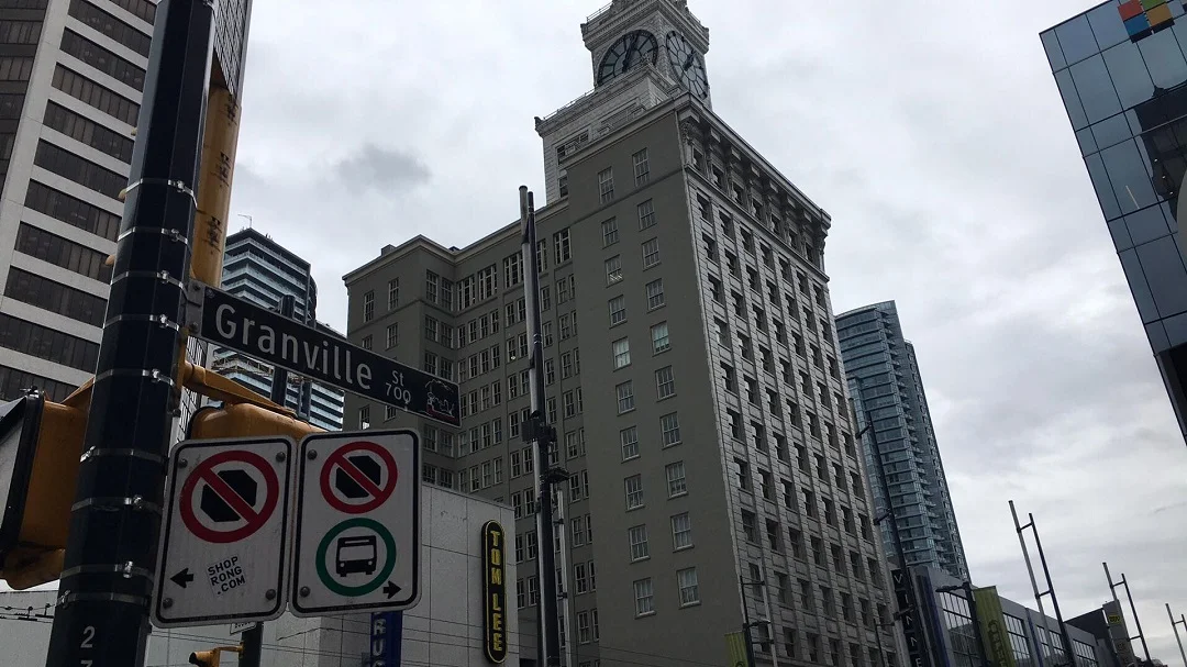Vancouver BLock (clock tower) next to Tom Lee on Granville street. Photo: Lee Rivett