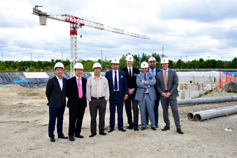 Executives from King Square Ltd, OMJ Capital and Fortress Real Developments at the King Square site where construction was underway.