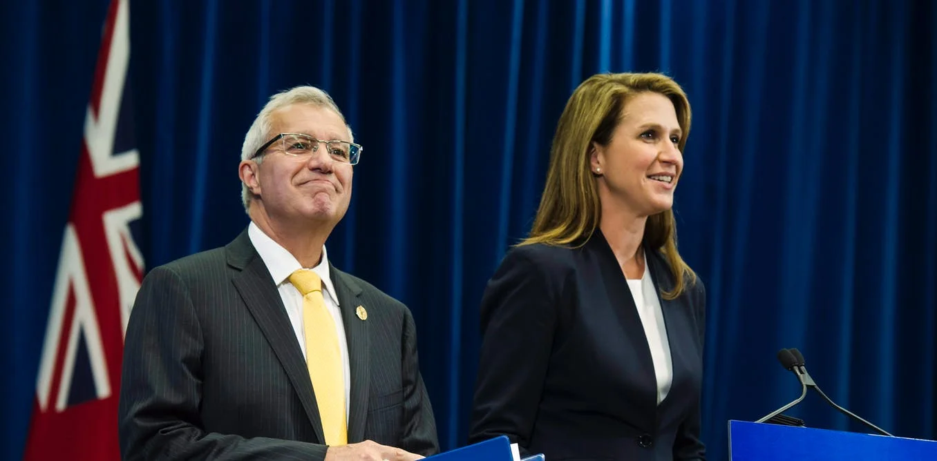 Vic Fedeli, Ontario’s finance minister, and Attorney General Caroline Mulroney talk to the media after announcing Ontario’s cannabis retail model on Aug. 13. THE CANADIAN PRESS/Christopher Katsarov