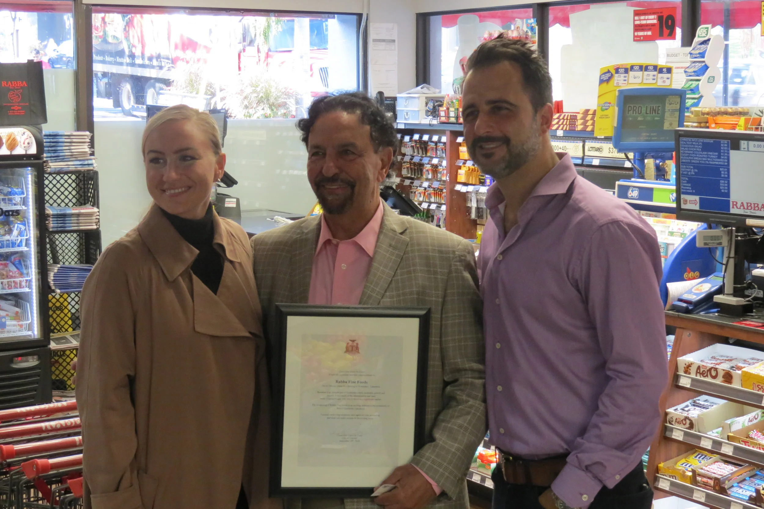 MPP Etobicoke Centre Kinga Surma and Ward 5 Councillor Justin Di Ciano, presented a Congratulatory Scroll to Rabba Fine Foods founder Jack Rabba, during the grand re-opening at the 4869 Dundas St W location.
