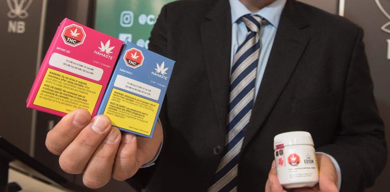 Brian Harriman, Cannabis NB president and CEO, displays some cannabis products at a Cannabis NB retail store in Fredericton, N.B., on Tuesday October 16, 2018. THE CANADIAN PRESS/Stephen MacGillivray