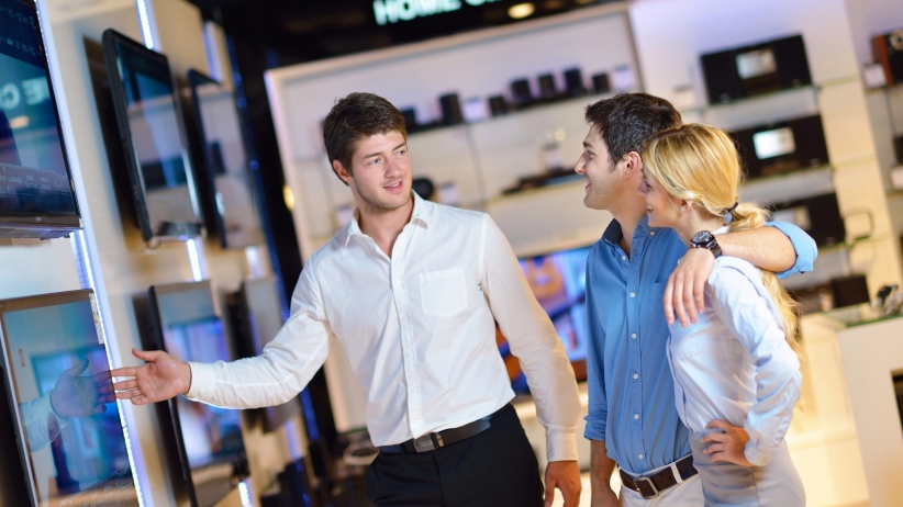 20160329172708-electronic-store-buying-consumer-purchasing-flat-tv-features-salesman.jpeg