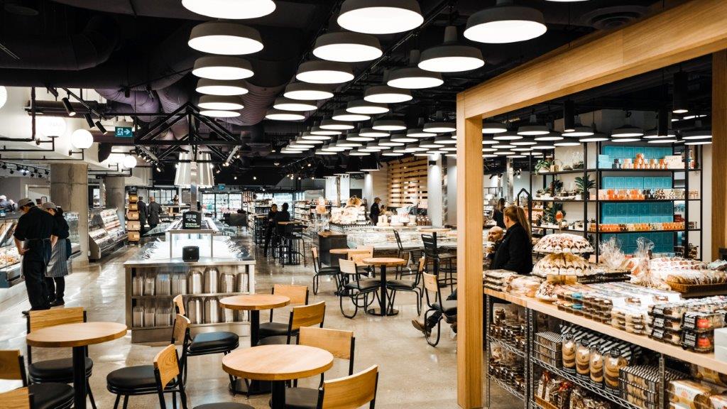 Seating area at the centre of the store, with gourmet desserts to the right.