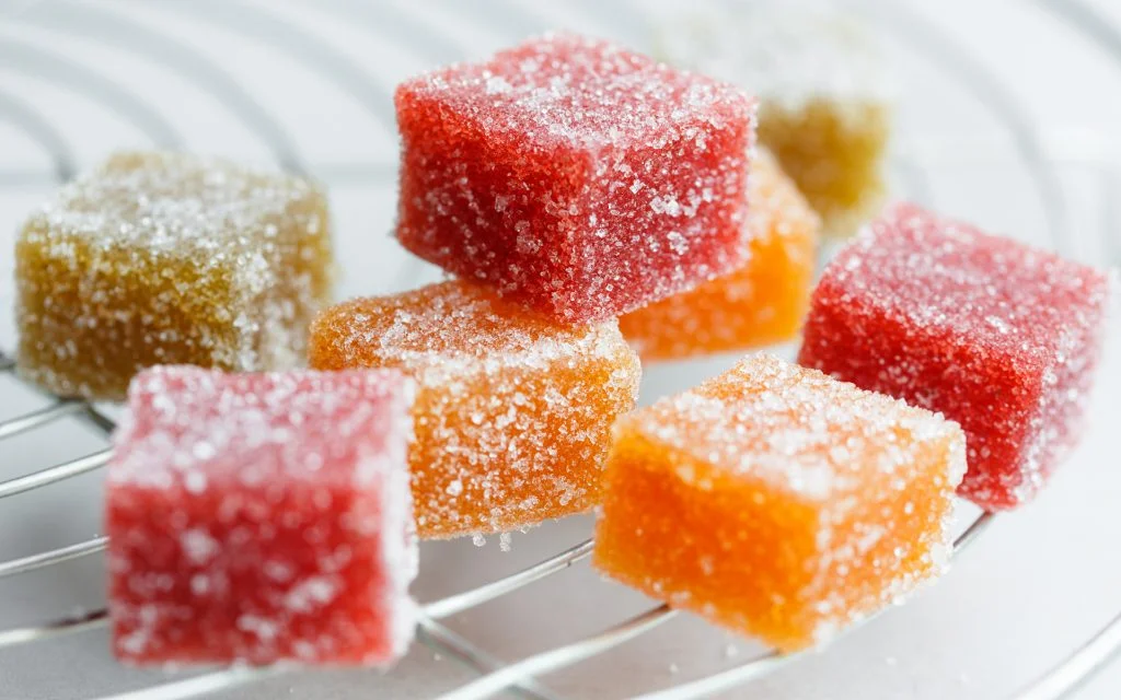 Fruit cube jelly candy on cake rack photo: via leafly