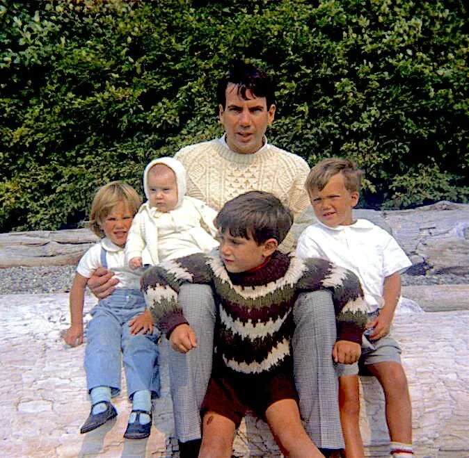 John Williams with children Mark (in front centre), Michael (facing right), Megan (facing left), and Andrea as a baby.