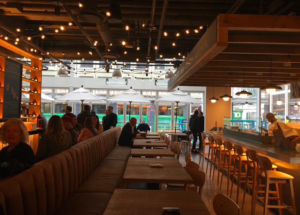 In the summer months, windows on the west side of Eataly can be opened to create a terrace-like experience overlooking Bay Street. Photo: Craig Patterson