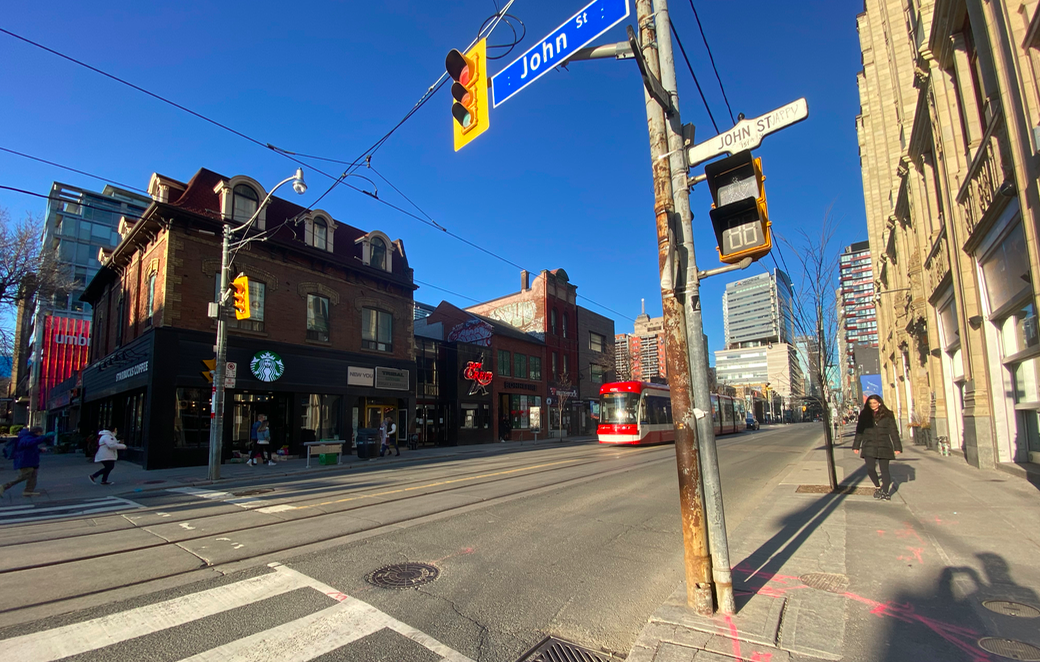 a quiet intersection at queen st and john st, toronto. photo: craig patterson