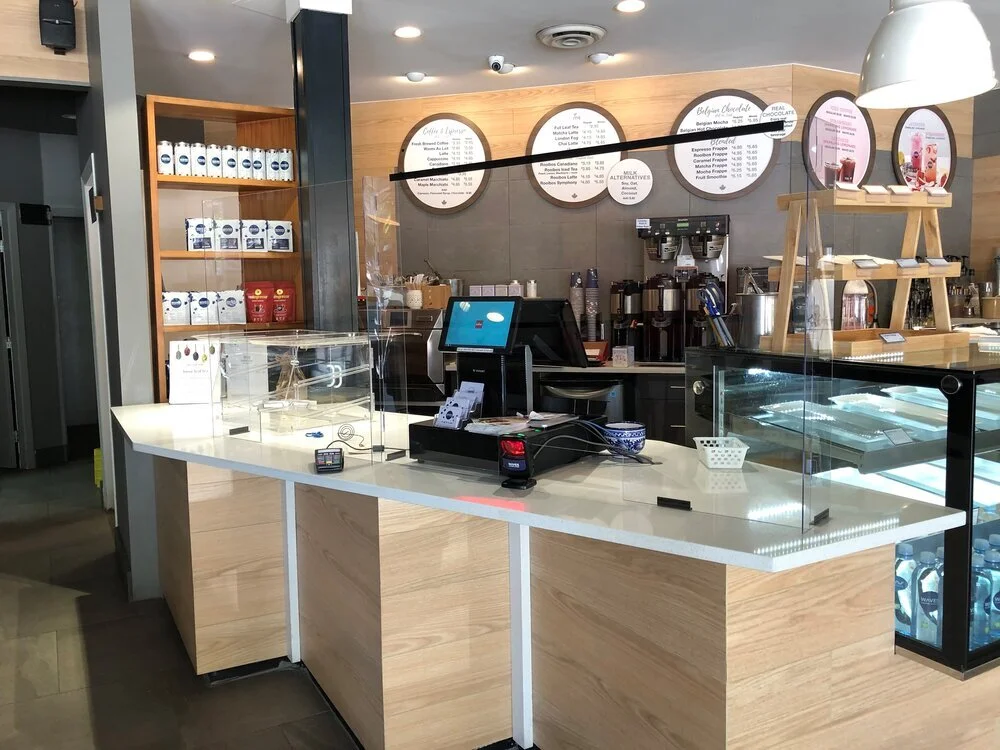 a cafe using a plexiglass shield at the counter. photo: peregrine