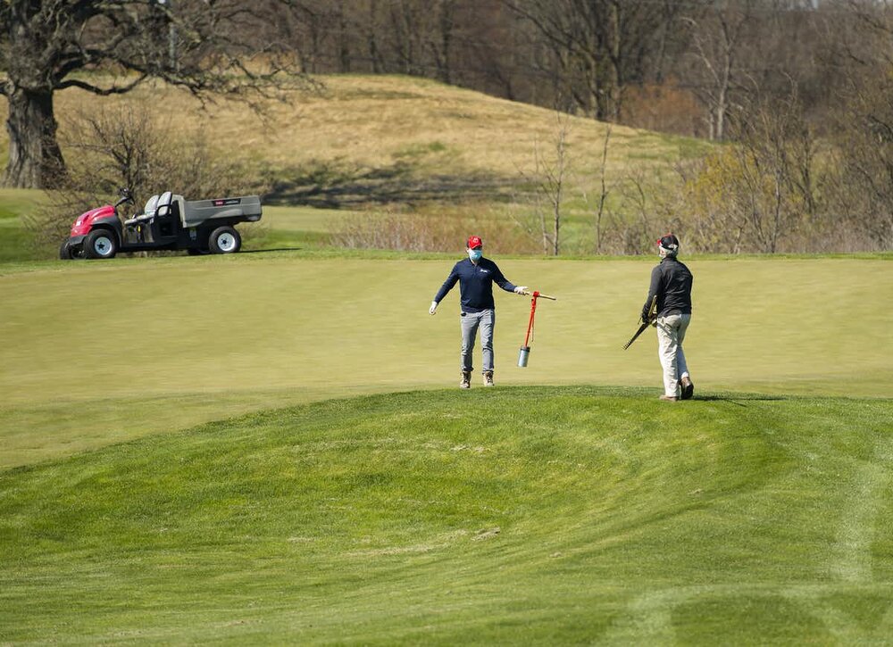 Grounds crew do maintenance as they prepare to open Piper’s Heath Golf Club during the COVID-19 pandemic in Milton, Ont., on May 13, 2020. photo: THE CANADIAN PRESS/Nathan Denette