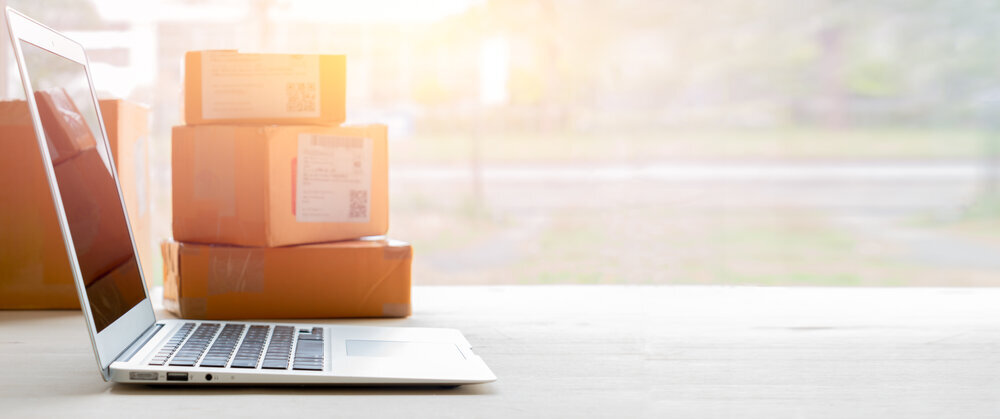Laptop With Shipping Boxes
