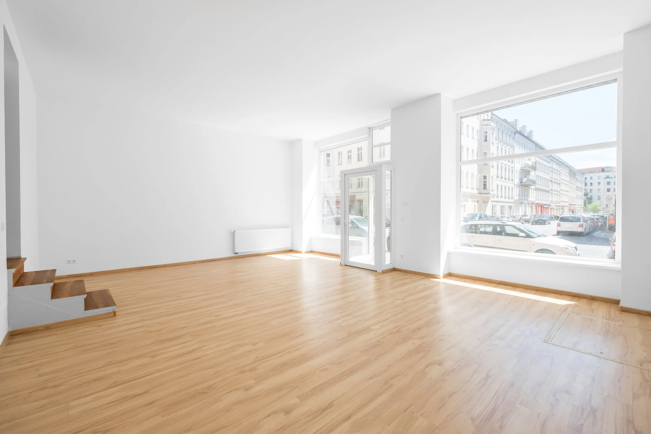 empty retail space facing out onto street.