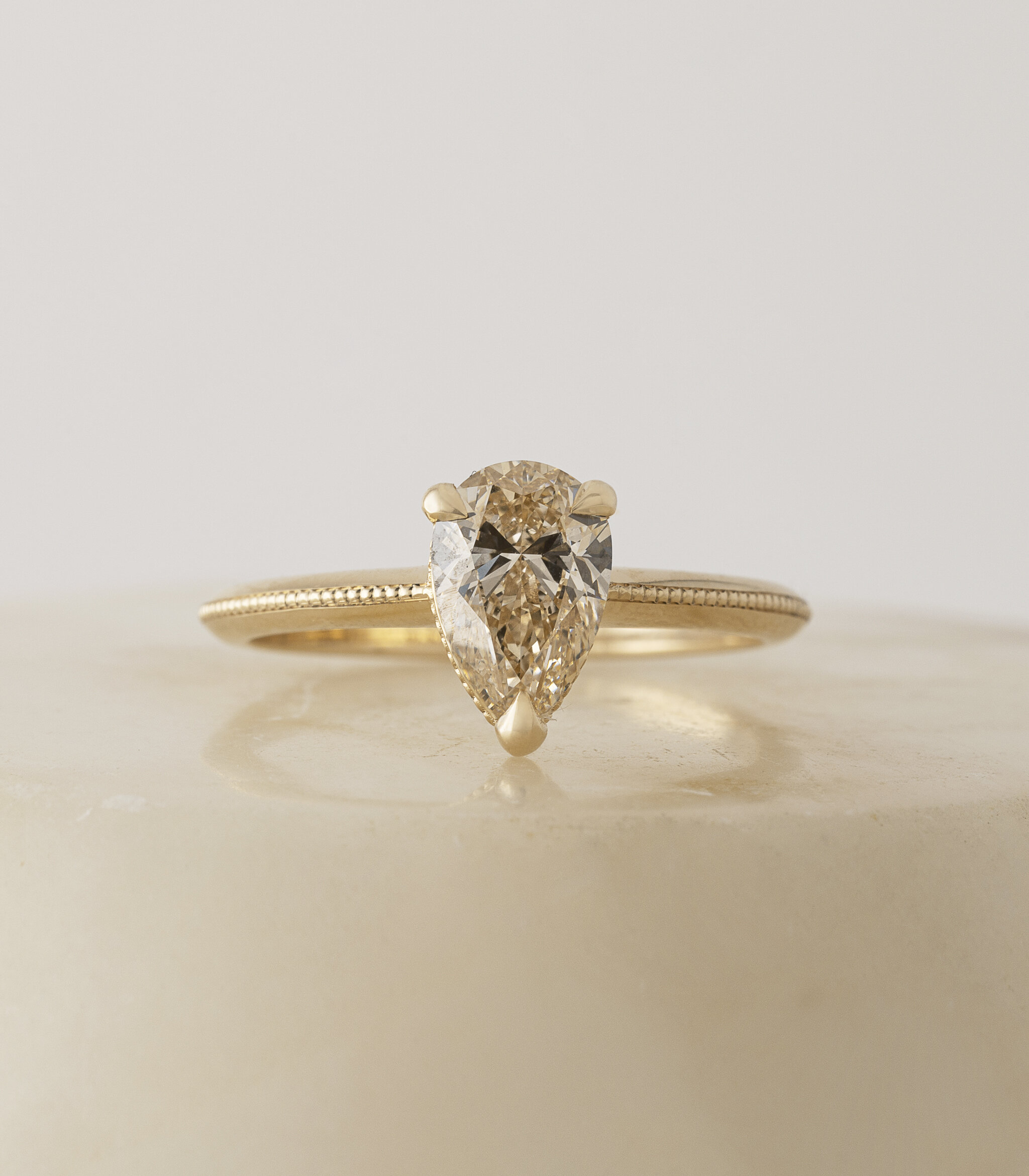   PEAR ALI RING IN CHAMPAGNE. PHOTO: ATTIC  