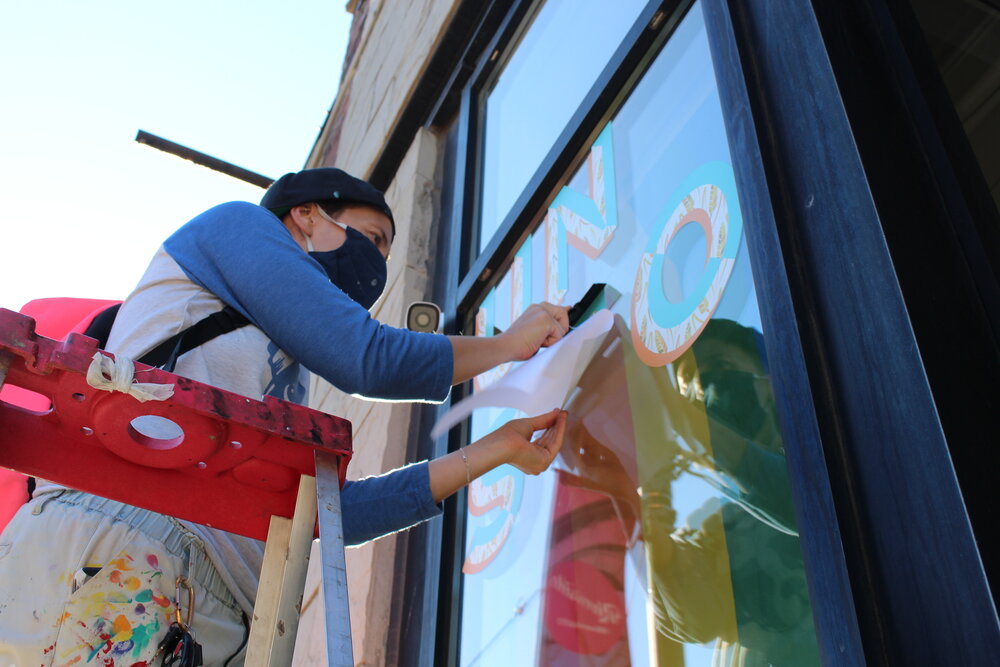   RIVERSIDE BIA HUMANS OF RIVERSIDE STOREFRONT EXHIBIT. PHOTO: JENNIFER LAY  