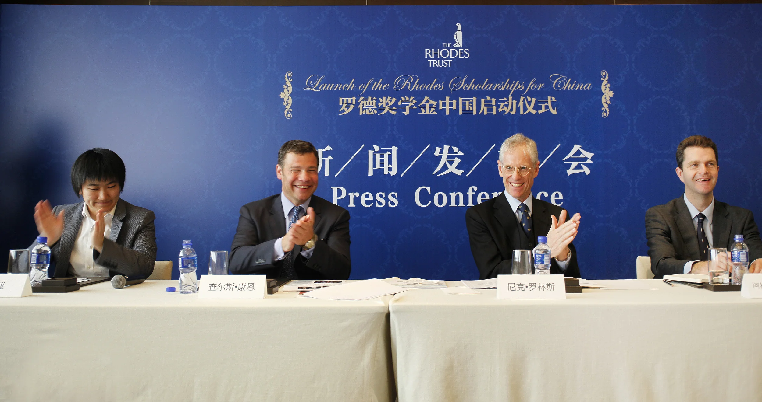 Harvard Club of Shanghai Board member Meijie Tang, AB '09 (far left) at the press conference