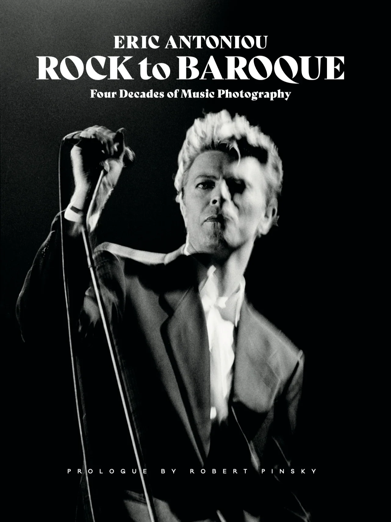 Photo book cover for Rock to Baroque, featuring a monochrome image of David Bowie on stage.