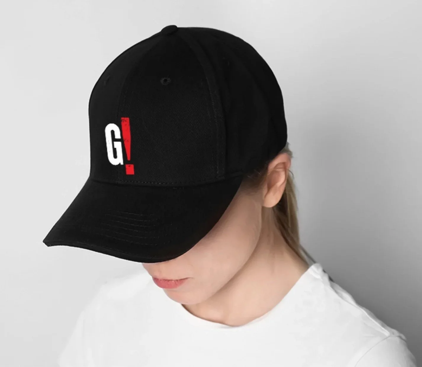 Black baseball cap with branding graphics printed on the front in white and red, worn by a Caucasian girl in a white T-shirt against a plain white background.