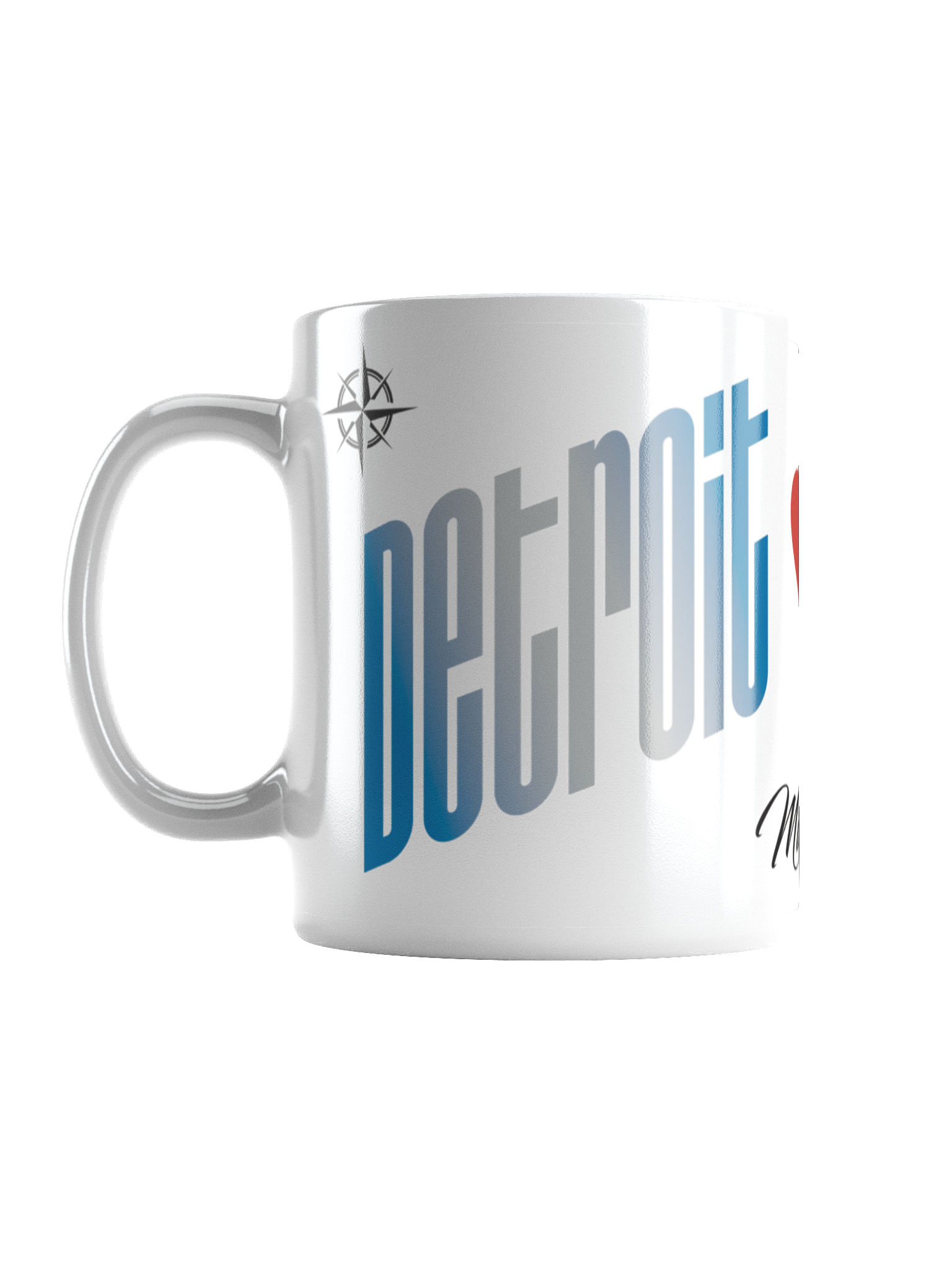 A white ceramic mug with a colorful, stylized text design that is partially visible, reading 'Detroit' in large, bold letters in a blue and silver gradient. The mug also features a small compass symbol near the handle.
