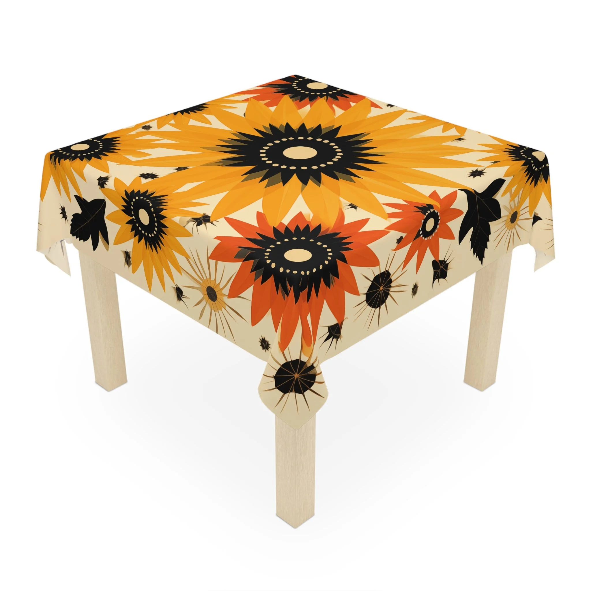 Table with a colorful sunflower-patterned tablecloth featuring black, orange, yellow, and beige flowers.