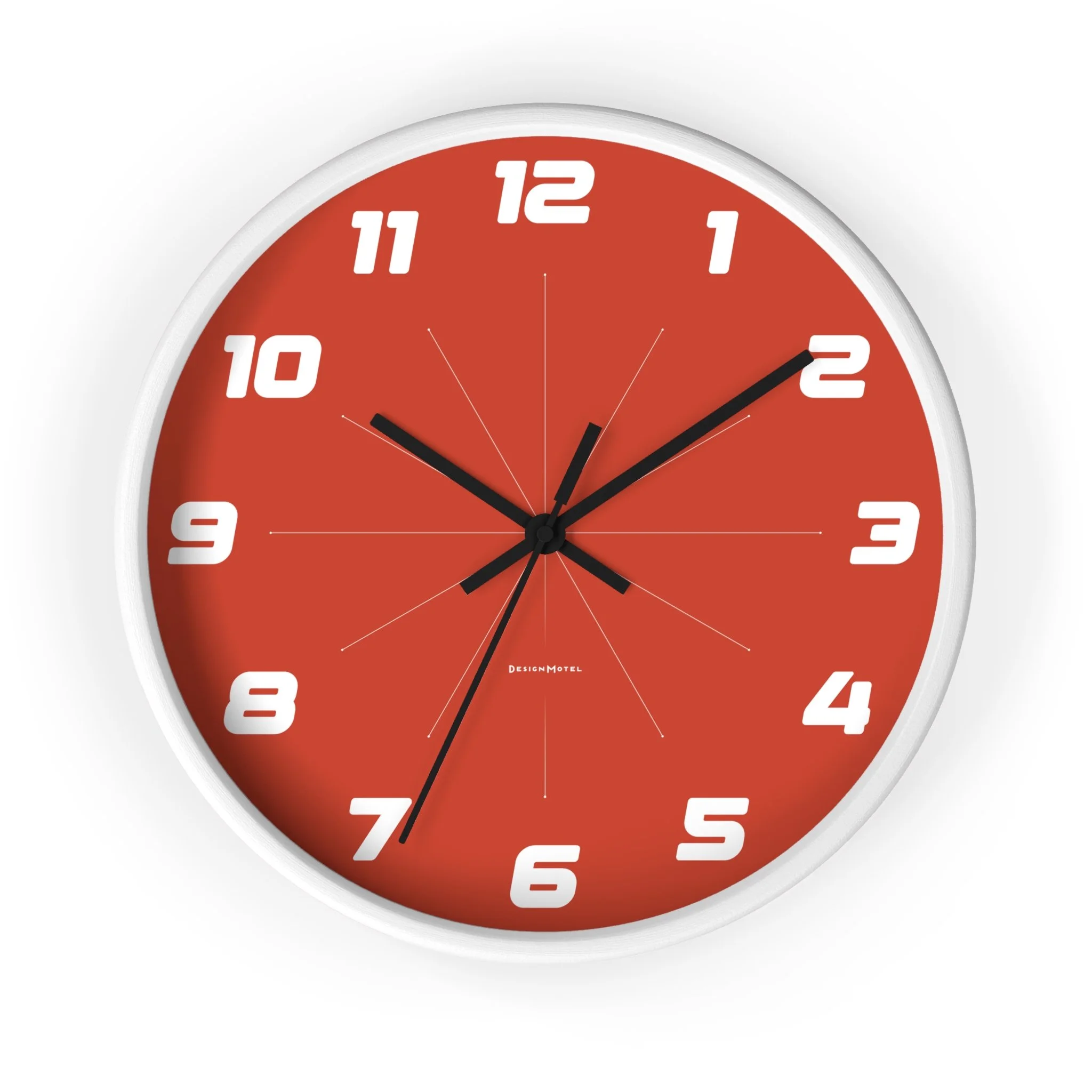 Red wall clock with white numbers and black hands, showing the time as 10:10.