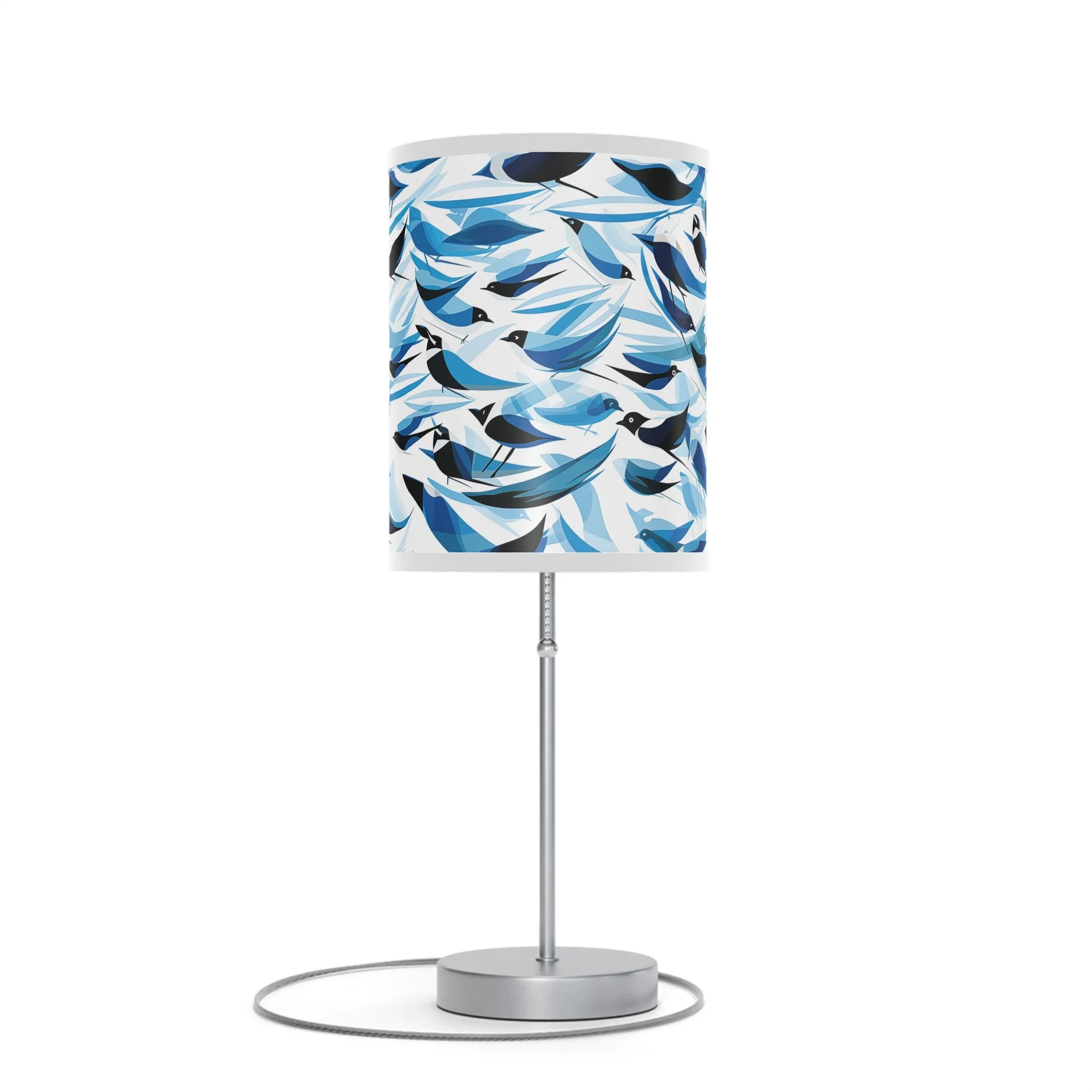 A modern floor lamp with a cylindrical shade featuring a pattern of abstract birds in shades of blue and black.