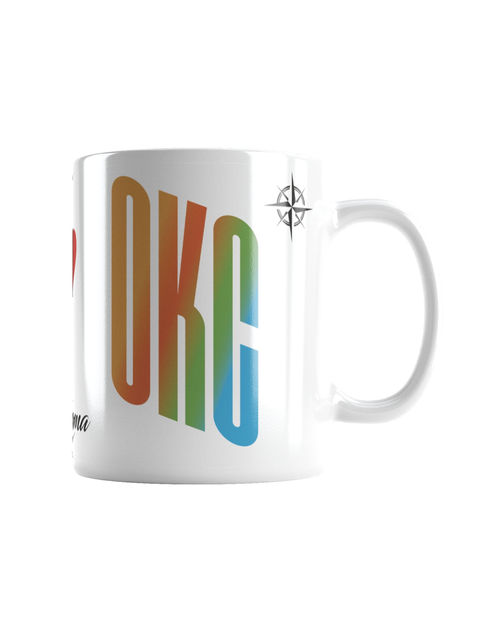 Close-up of a white ceramic mug with colorful rainbow text and a black compass logo on the upper right side.