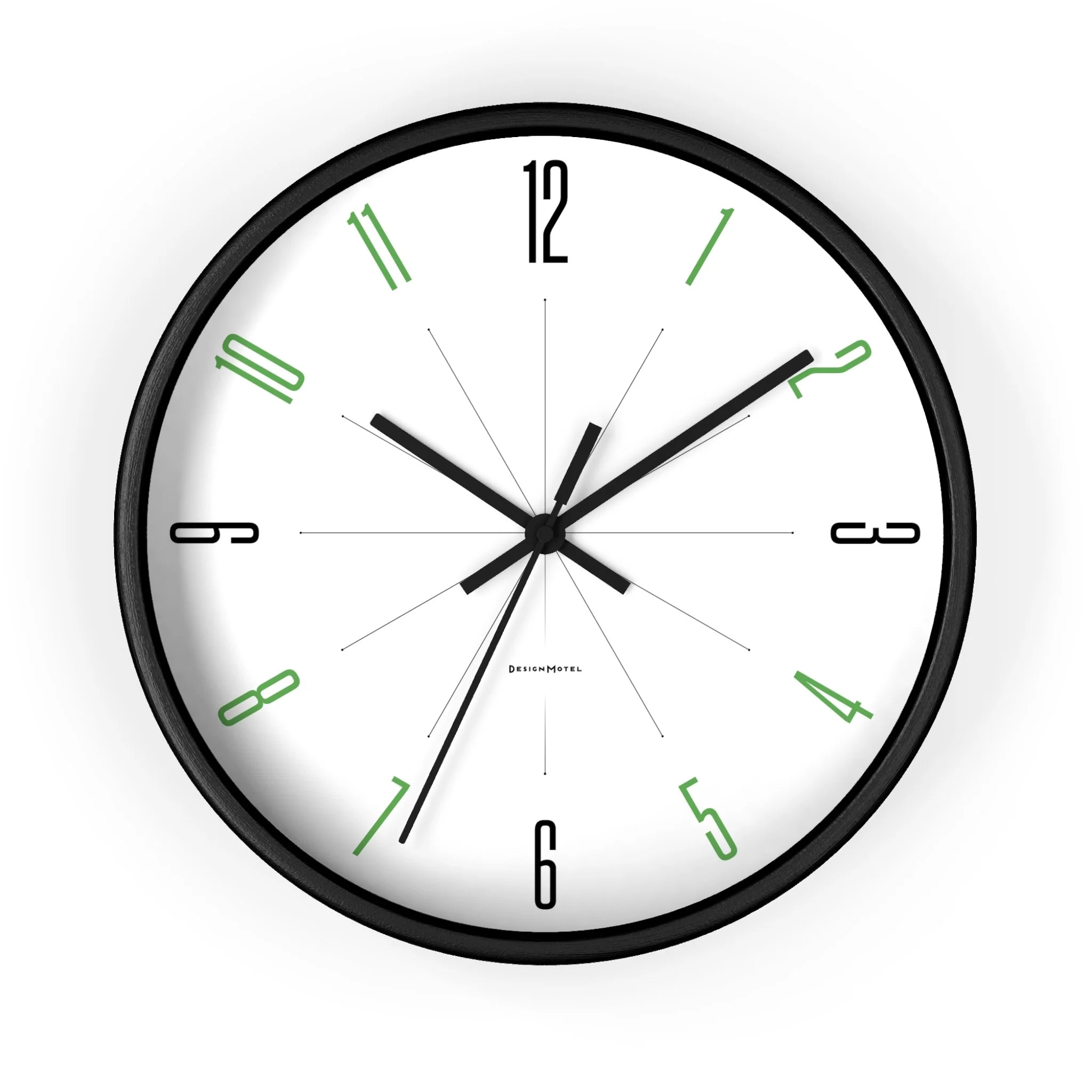 A round wall clock with black frame, white face, black and green numbers, and black and silver hands indicating 10:11:36.