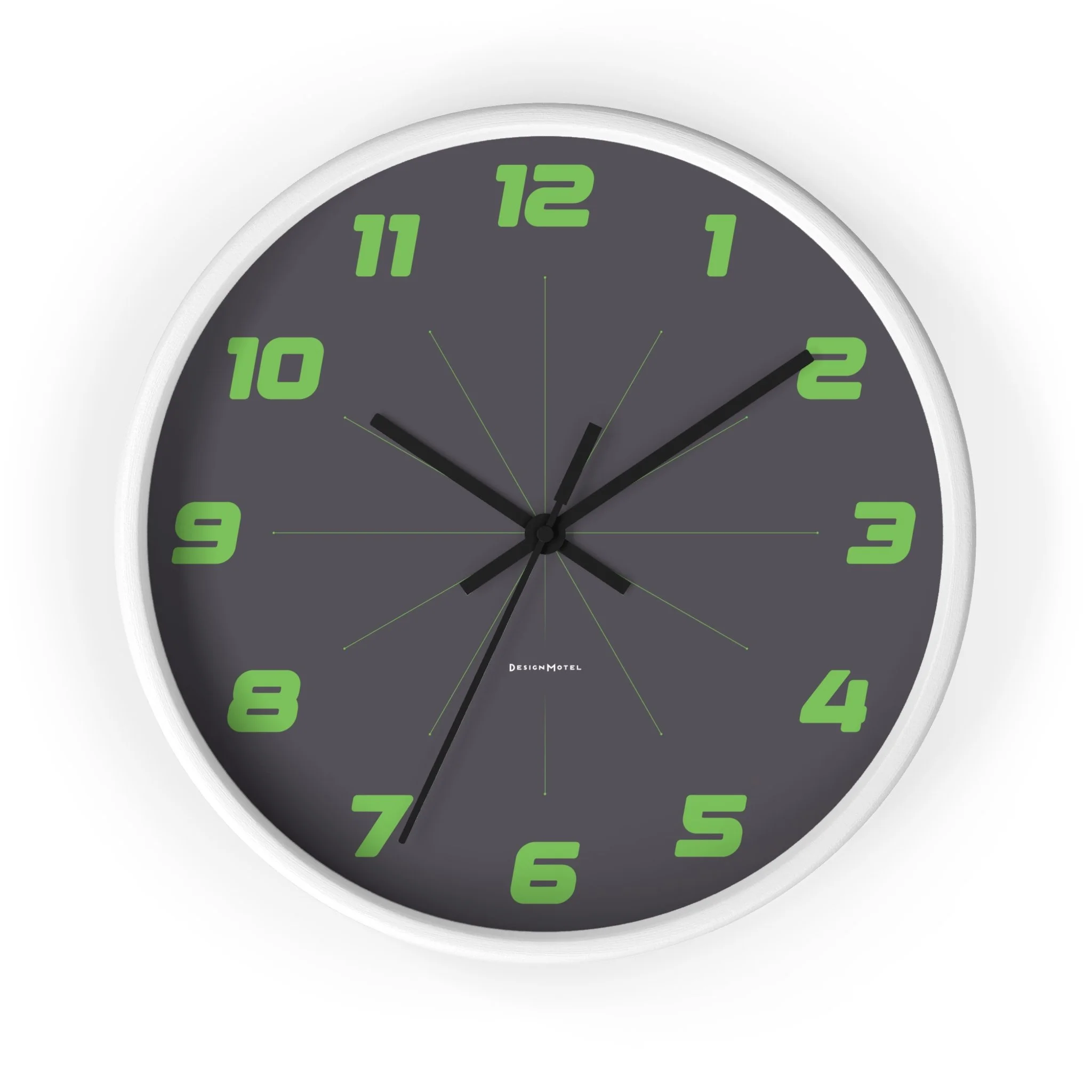 Round wall clock with a dark gray face, green Arabic numerals, and black hour, minute, and second hands, showing the time as approximately 10:12.