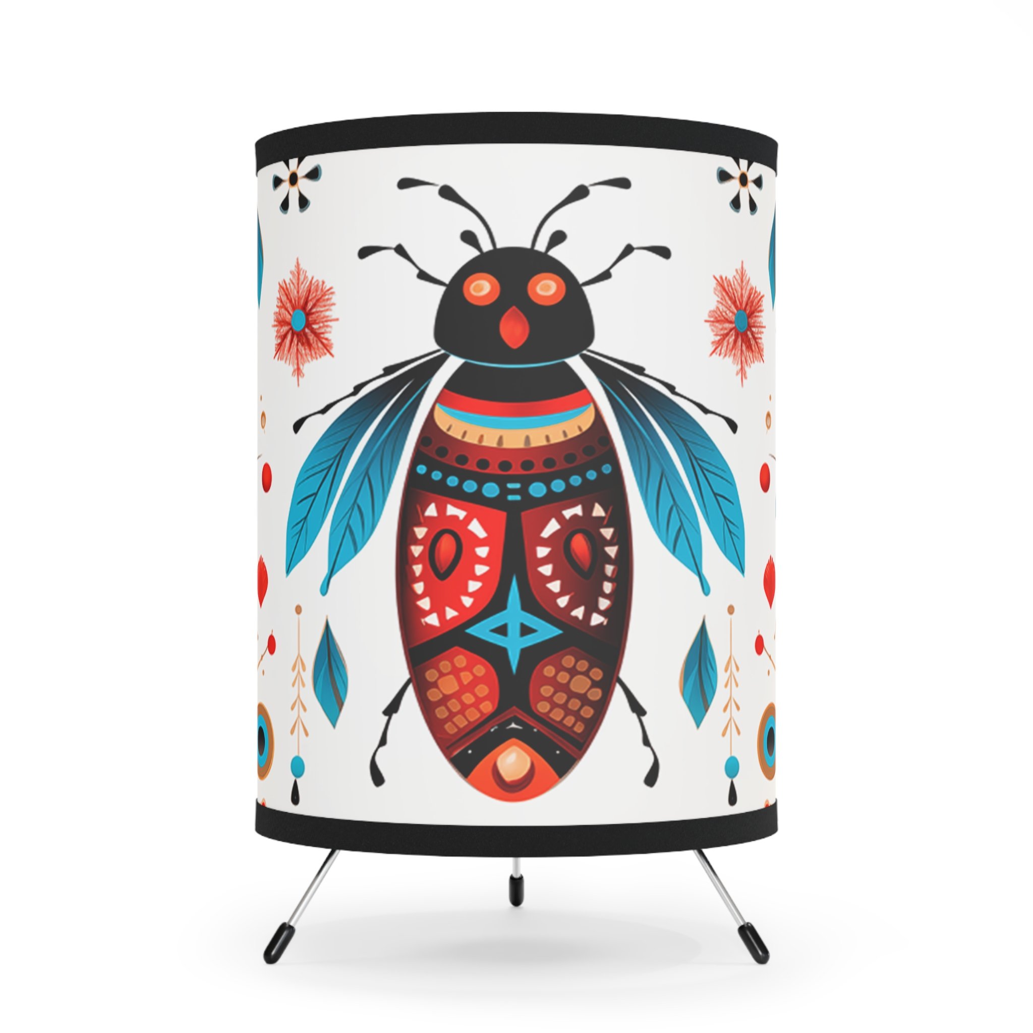 A table lamp with a decorative shade featuring a colorful, stylized insect design, including a black head with orange eyes, blue wings, and a detailed red, black, and blue body with geometric patterns.