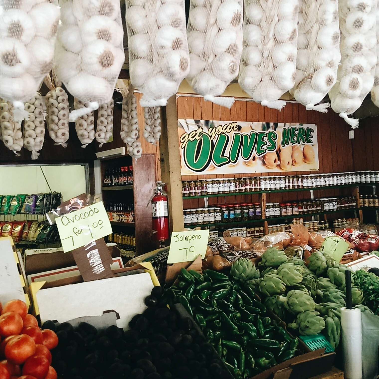 The farmer's market where we got 7 avocados for $1, 5 sweet corn for $1, and a bunch of onions and garlic for $2, totalling out to $4...what!
