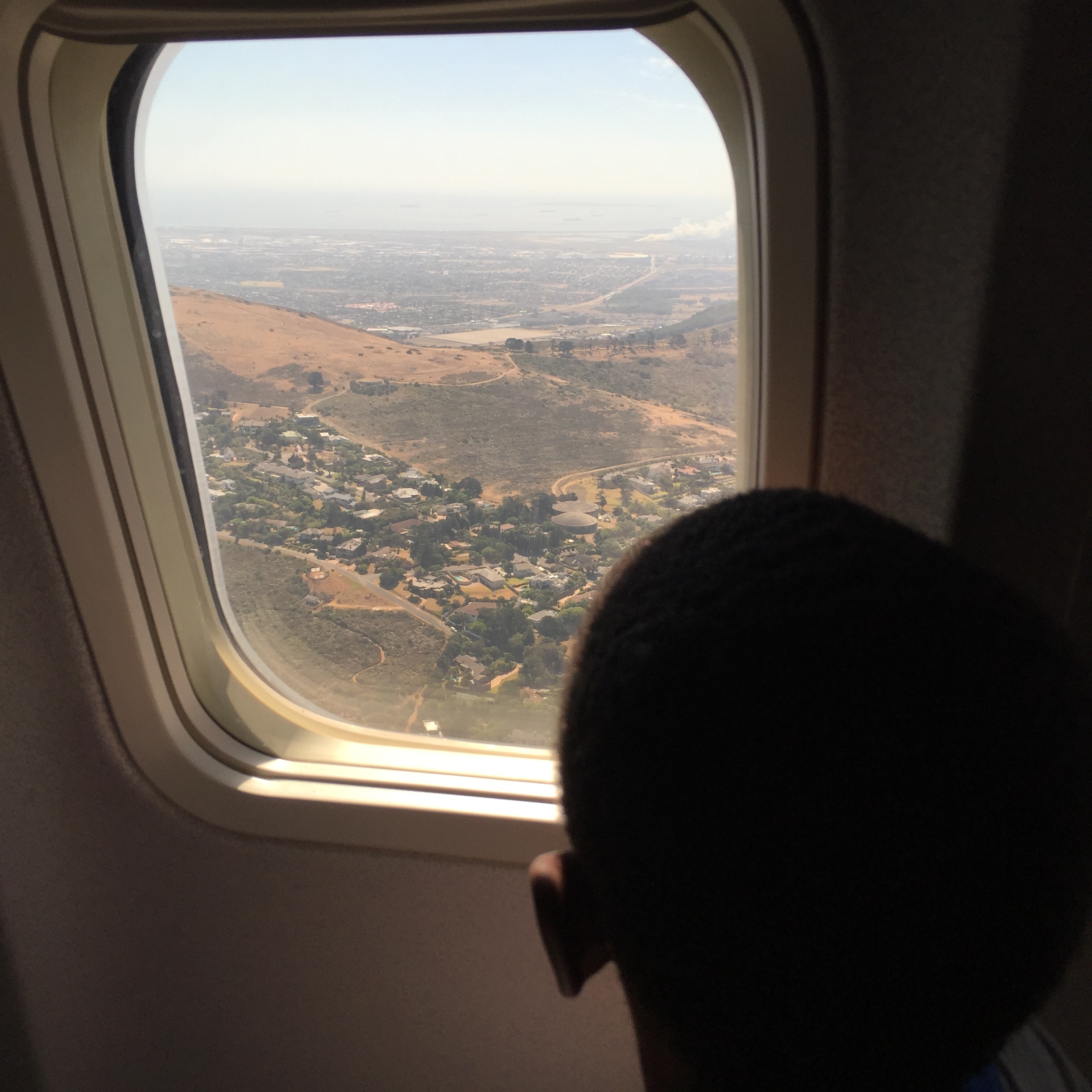 Tisetso loved looking out the window when we were getting ready to land.