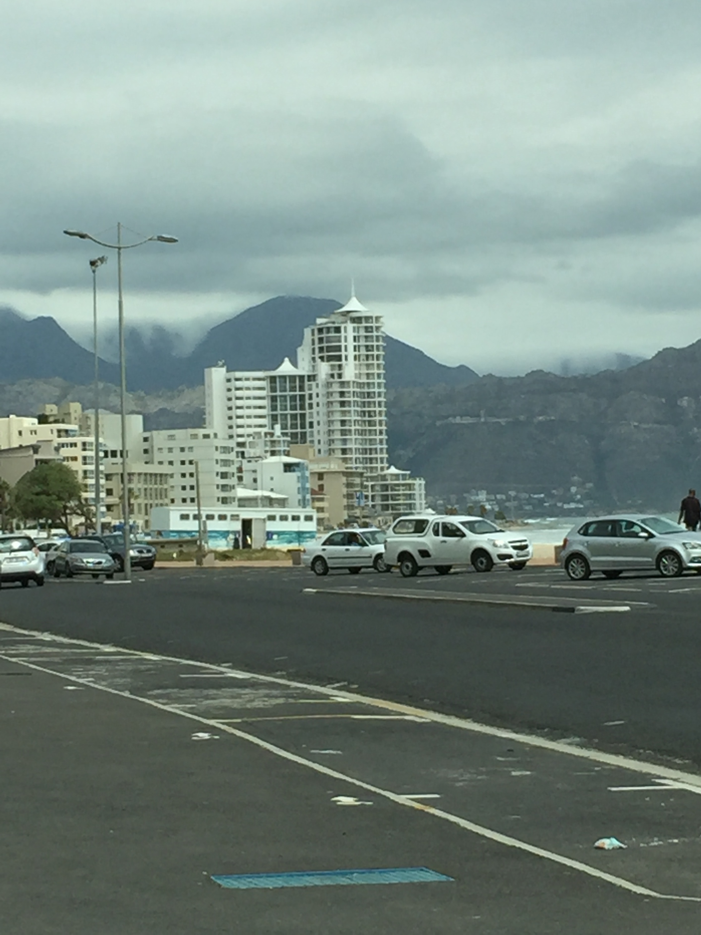 The clouds looked so cool on top of the mountains. It was as if they were pouring over the peaks. Also, the tall, white building with the pointy hat is the one where we're staying.