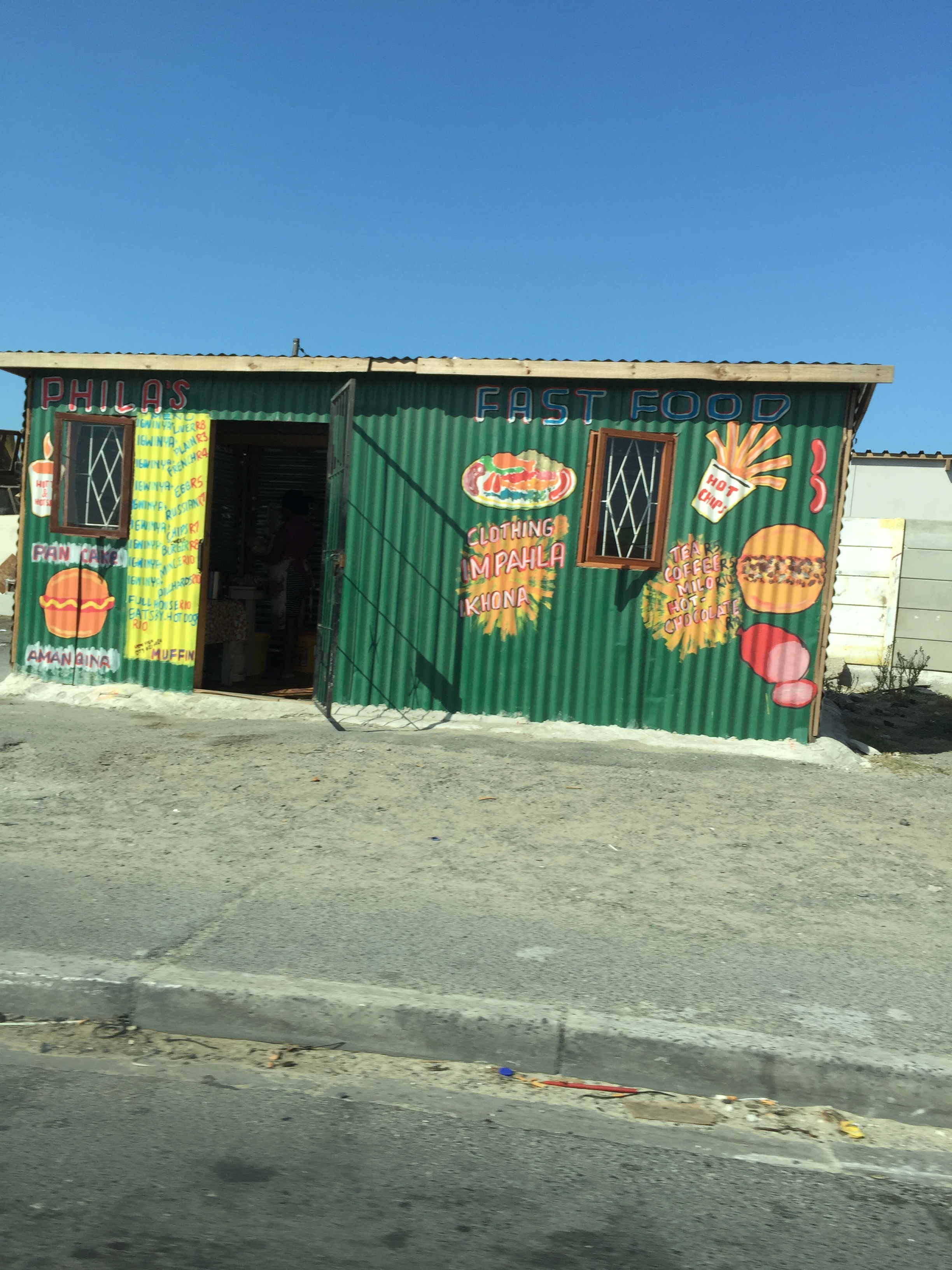 A lot of the shipping crates have been turned into shops with colorful murals painted on them advertising what's inside.