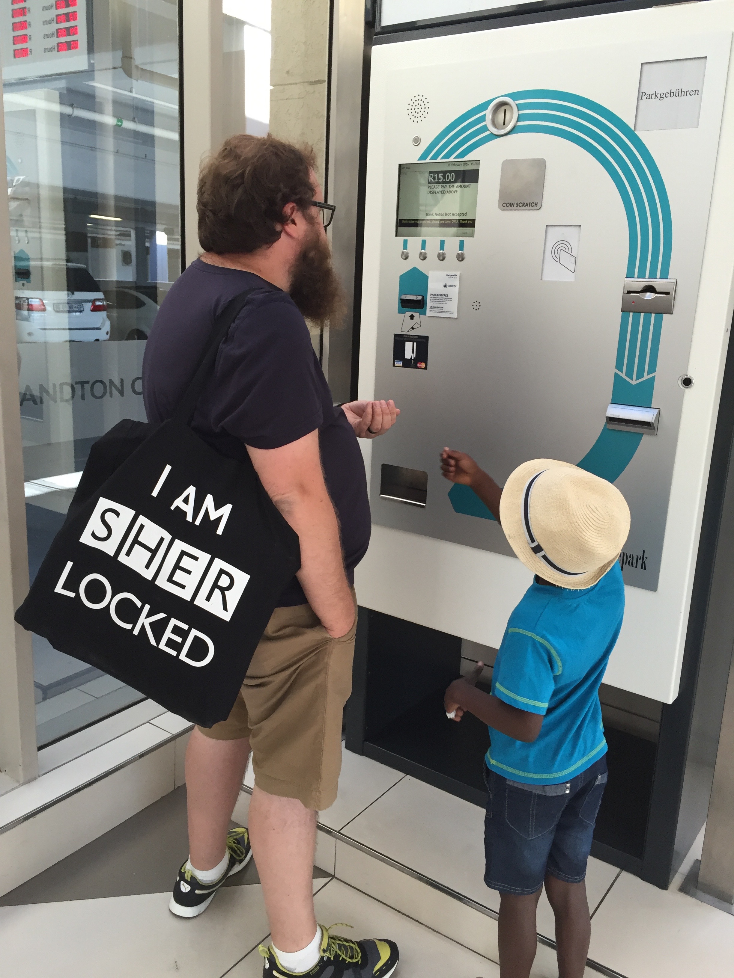 Brian and Tisetso paying for our parking. It cracked me up seeing Brian walk around with my Sherlock bag.