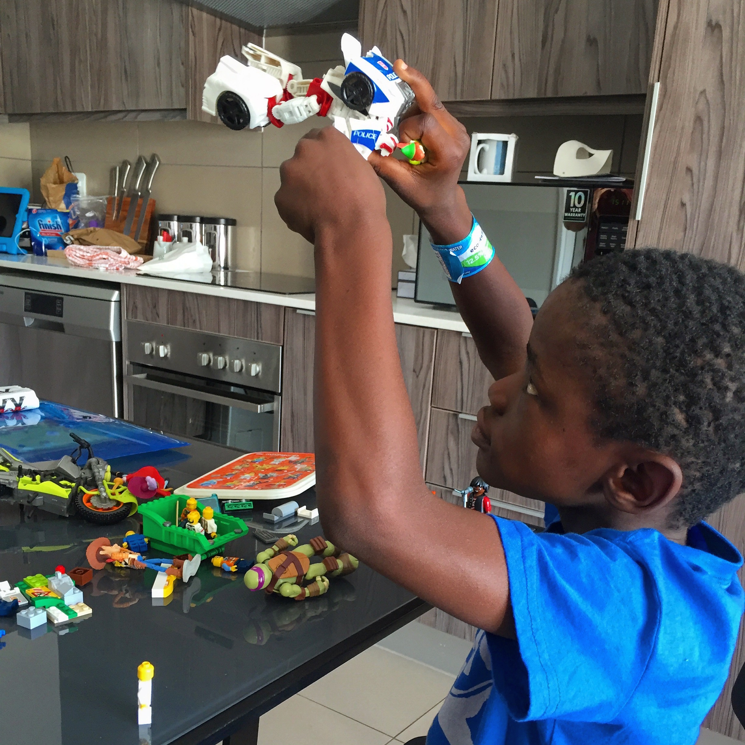 Playing with his Legos and new Transformer.