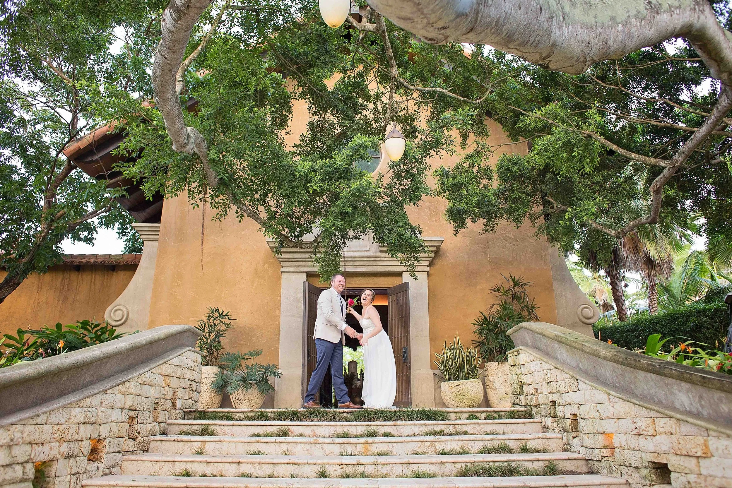 a couple stands hand in hand in front of the spa botanico at dorado beach a ritz carlton reserve