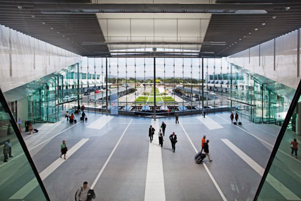 The new GMB designed passenger terminal spans approximately 60,000m2 with parking for over 2400 vehicles, rooftop commercial buildings, elevated road ways, green credentials including: a gas powered tri-generation plant, absorption chillers that capture and use excess heat, a 650,000 litre water tank that collects rain and ground water for reuse and energy efficient lighting systems which are used throughout the building – as well as extensive work to airside aprons and taxiways.
