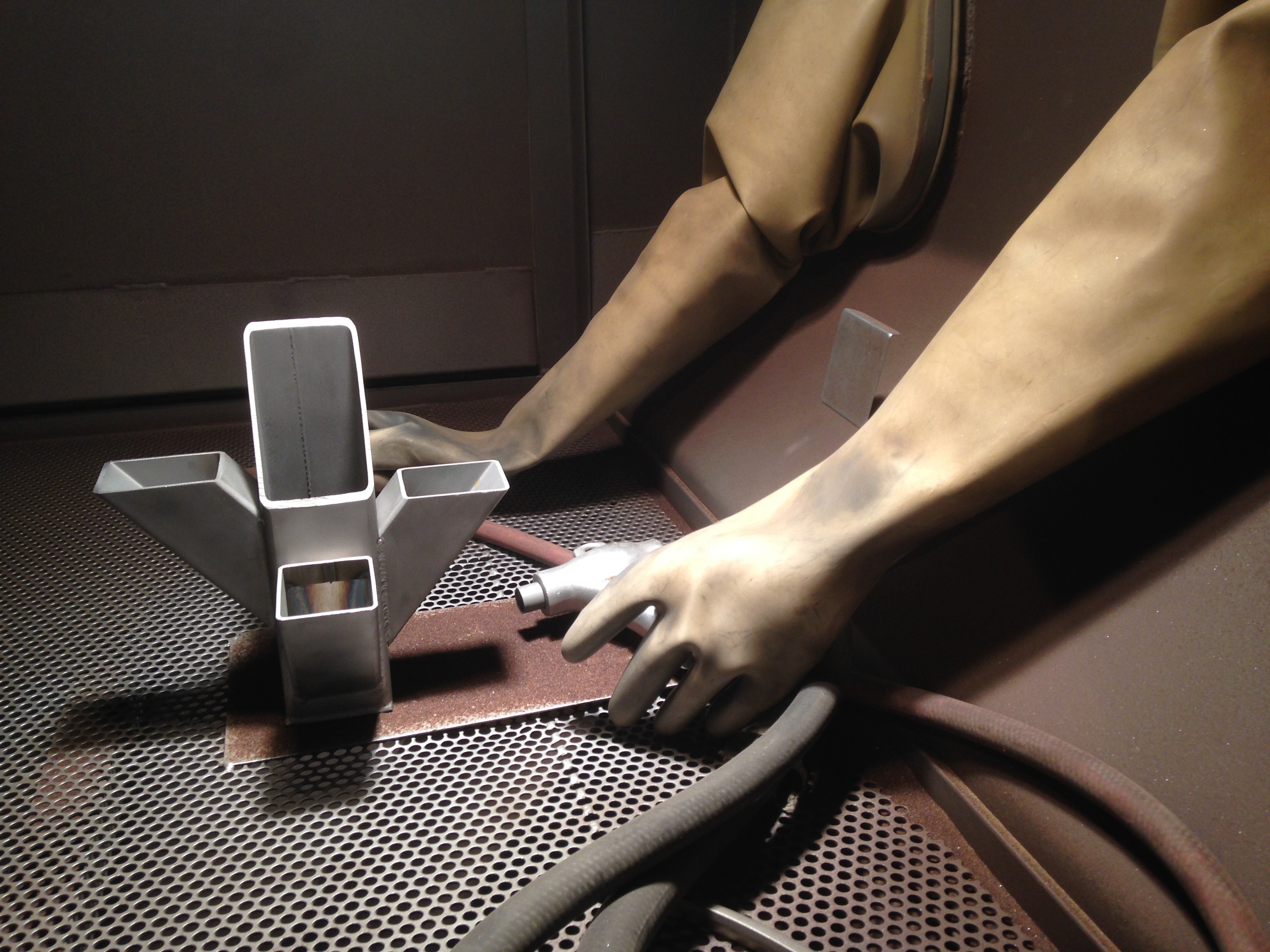 Sneak-peek at the final product inside the sand-blasting machine.