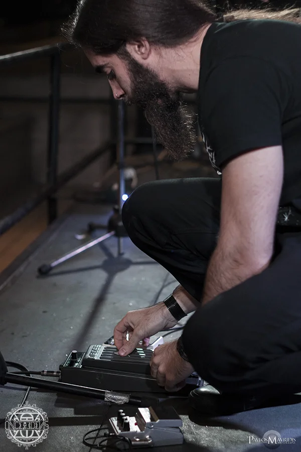 Telis Mimoglou, guitarist and vocalist setting up his gear.