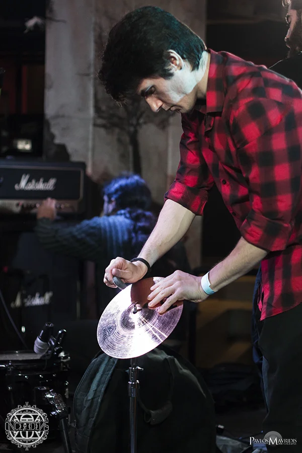 Defkalion Dimos, the band's "drum machine" setting up his drum set.
