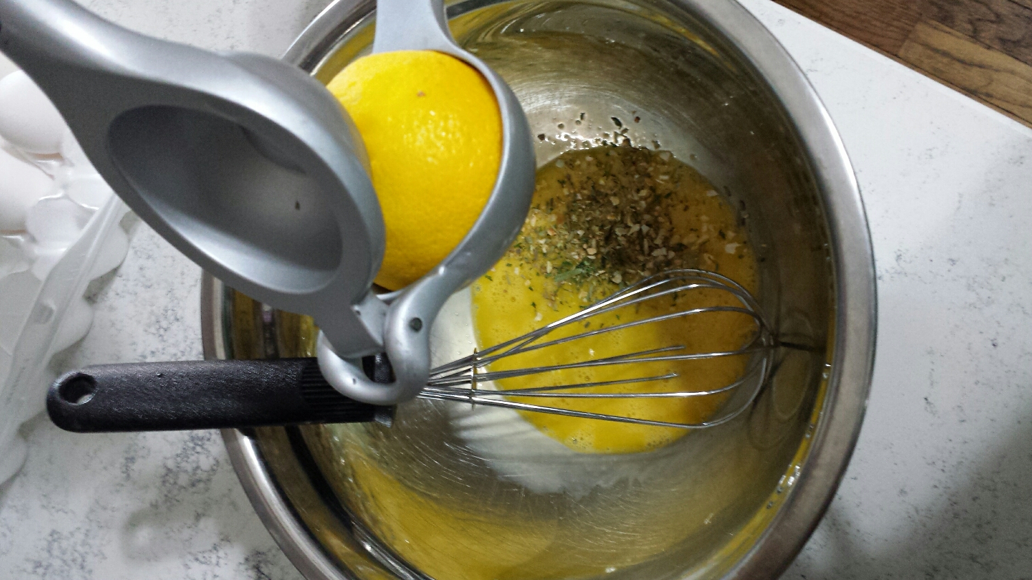 Place two egg yolks in a bowl. Add 1 tsp of South of France and the juice of half a lemon. Whisk until the eggs are doubled in size and slightly frothy.