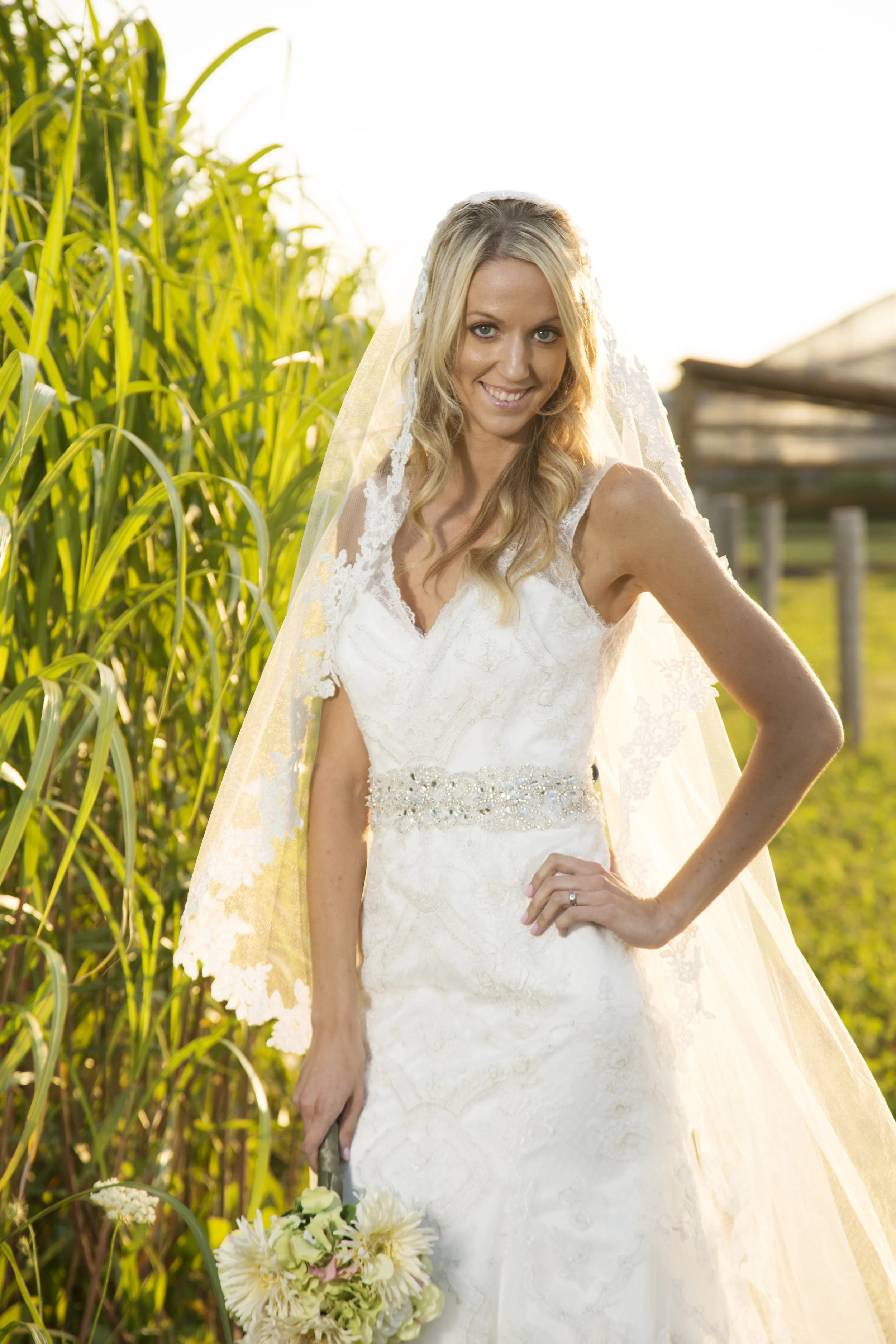 Erin of Once Upon A Time Weddings chose this new arrival to Once Upon A Time Weddings because she felt like it captured perfectly the mixture of rustic with elegance. It is part of a new line of wedding gowns, Fiore Couture, that is available exclusively at Once Upon A Time Weddings. We are so excited to carry this line and to continue providing our brides with beautiful and exclusive gowns. The long veil add that elegant and romantic feel to the gown. It is also available at Once Upon A Time Weddings.