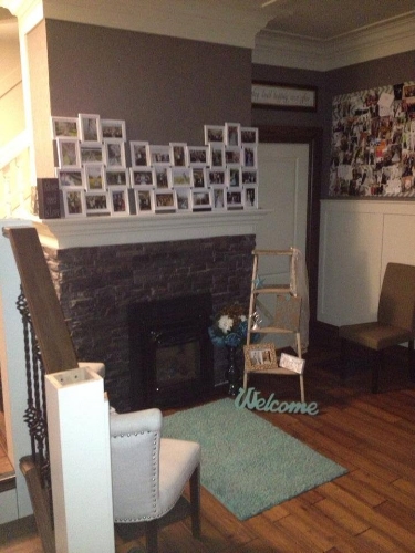 Once Upon A Time Weddings lobby equipped with a gas fireplace & comfy seating.