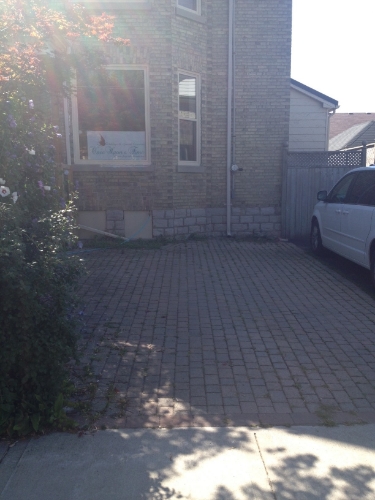 When coming to the bridal store, you can park in the driveway if there's a spot there.