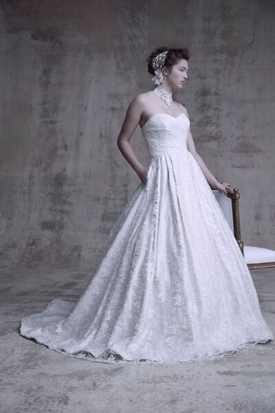 The perfect gown for an enchanted wedding is something simple and flowy. We adore this lace gown with pockets. It would look amazing with a small belt with a bit of beading or all on it's own.