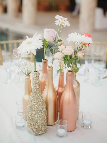 Collect wine bottles from family + friends and spray paint them, super affordable and chic!