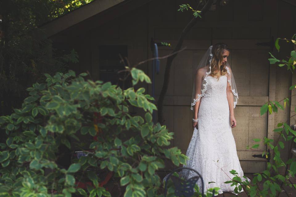 Once Upon A Time Wedding Real Bride wearing a strapless neck-line with her hair down.