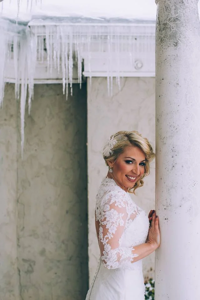 Once Upon A Time Weddings Bride added a lace jacket to her gown for the chilly weather.