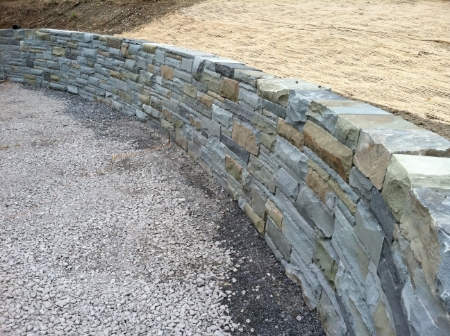 This is custom stonework at it's best. GreenScene installed this 50/50 bluestone block retaining wall (aka Llenroc) in Cayuga Heights , NY
